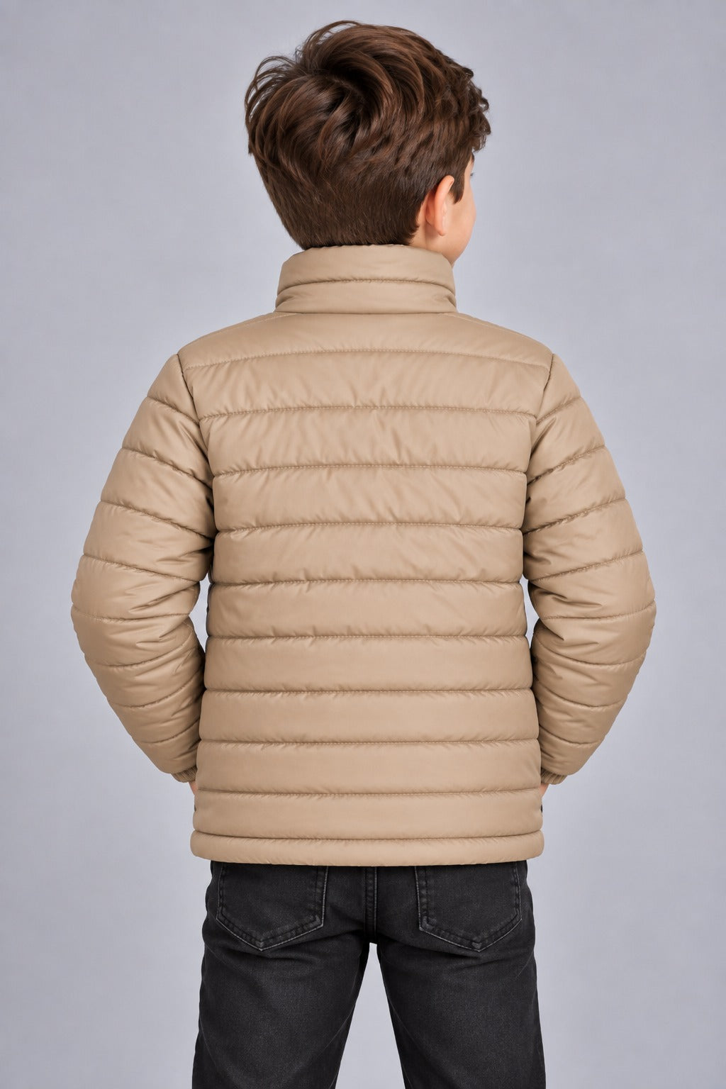 Young boy wearing khaki beige horizontal quilted winter puffer jacket back view