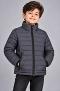 Young boy wearing charcoal grey lightweight quilted puffer jacket front view with zip closure