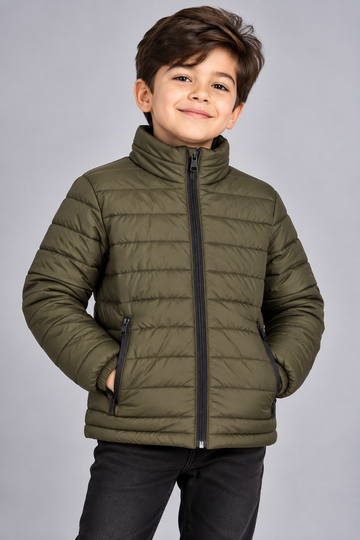 Young boy wearing olive green lightweight quilted puffer jacket front view with zip closure