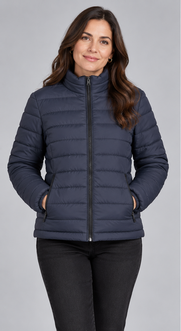 Woman wearing navy blue lightweight quilted puffer jacket front view with zip closure and stand collar
