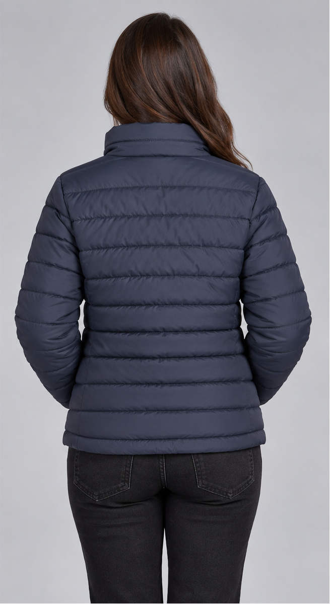 Woman wearing navy blue horizontal quilted winter puffer jacket clean back view